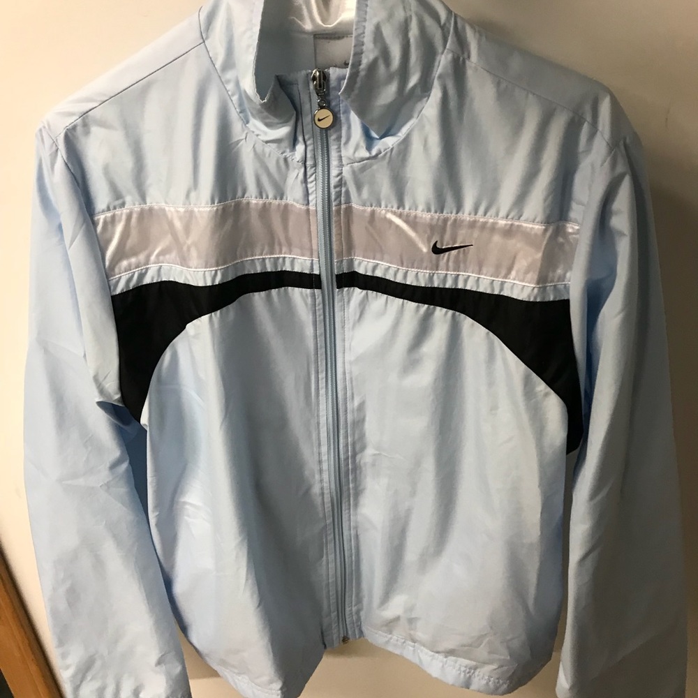 Blue Nike windbreaker.